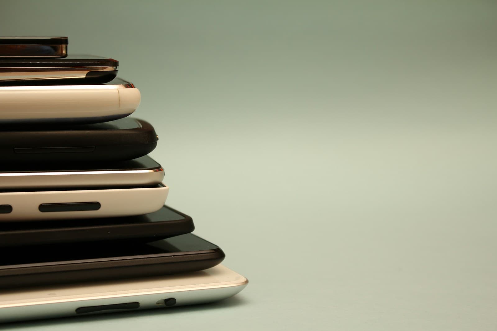A stack of old phones, one for every account